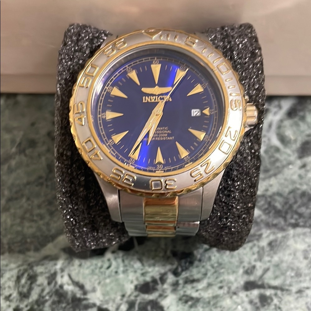Invicta Gold and Blue Watch with Luminous Hands and Date Window